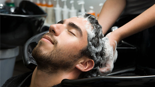 Man getting hair washed